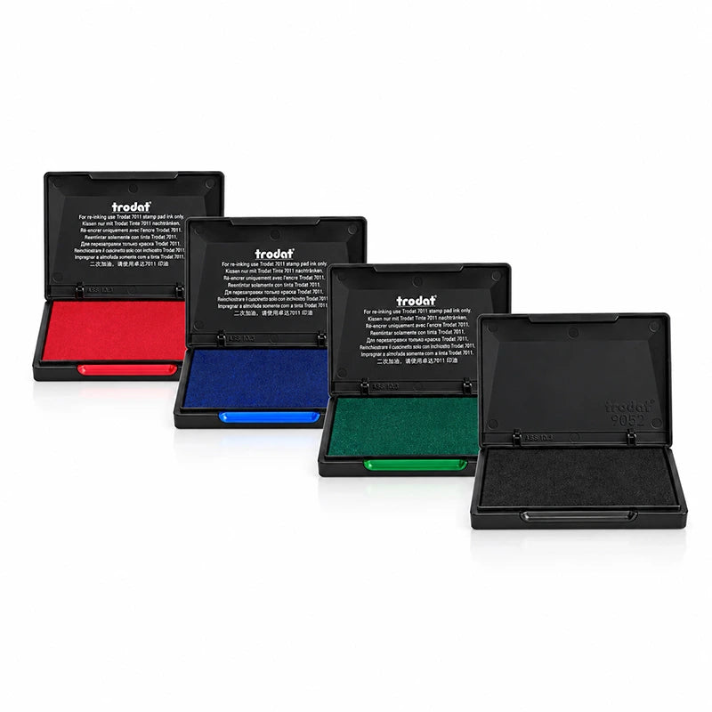 4 encreurs Trodat 9052 ouverts alignés : encre rouge, bleue, verte et noire