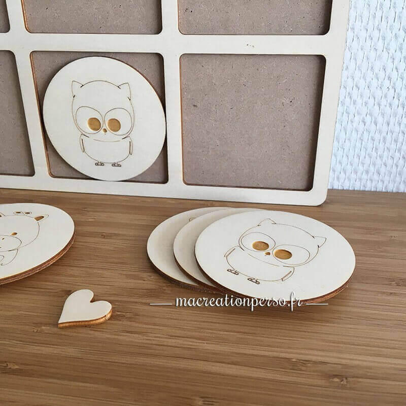 Pièces rondes en bois sur les animaux pour le jeu de mémoire en bois